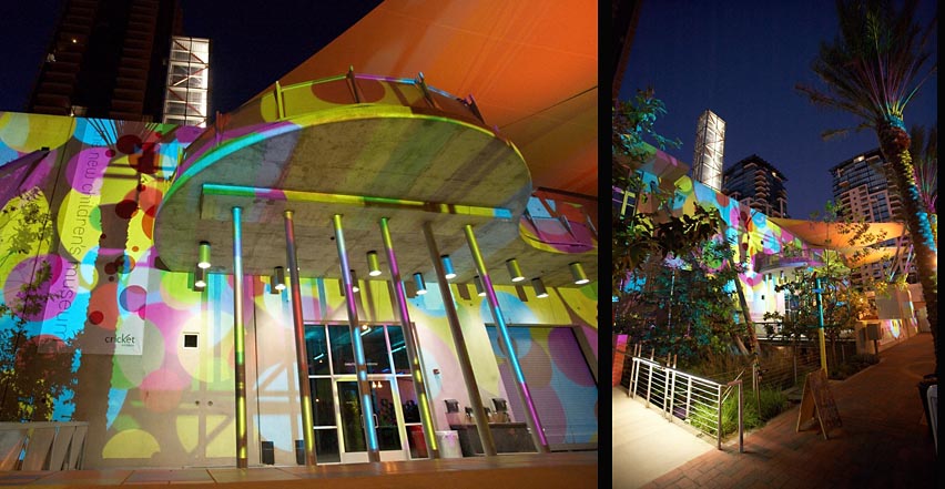 Event photography showing outside of building covered with multi-color lights at charity fundraiser in San Diego California.